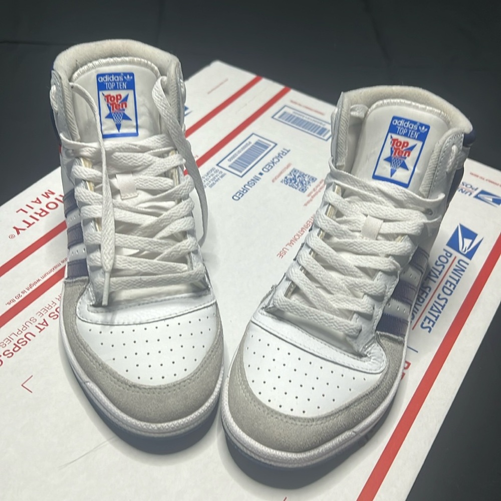 Addias top tens. White, blue, red, gray. Men sz.8